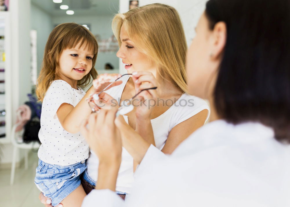 Similar – mother brushing toddler daughter’s hair