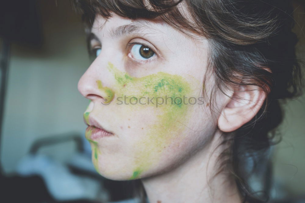 Similar – Junge Frau mit Farbe im Gesicht und einem Pinsel.