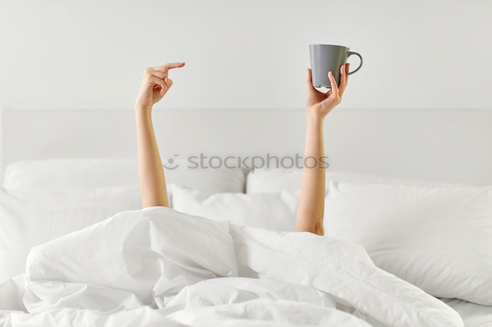 Similar – Image, Stock Photo Cup of coffee and spoon on wooden tray in bed on white sheets