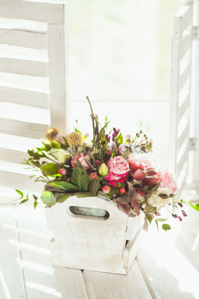 Similar – Image, Stock Photo Bouquet of flowers in a glass vase on the table in front of a window