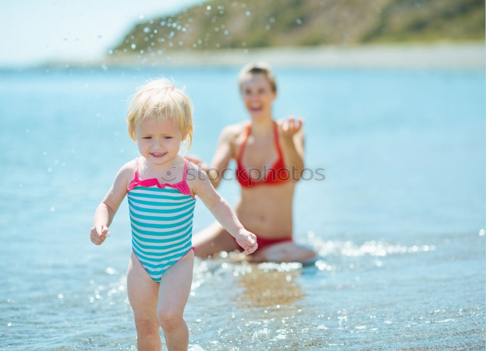 Two happy children playing on the beach