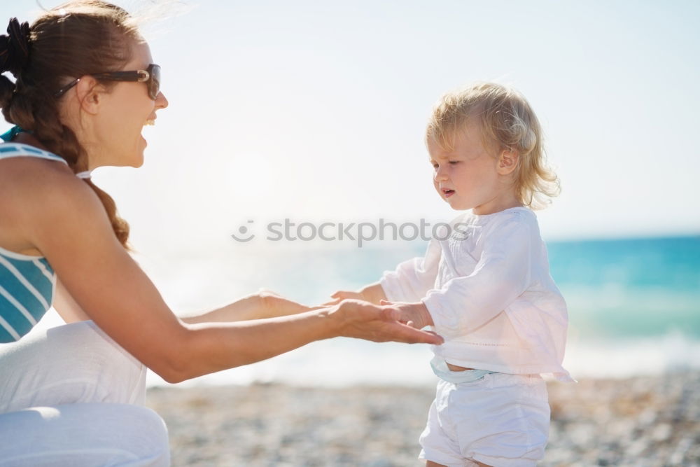 Similar – Sister and brother playing on the beach