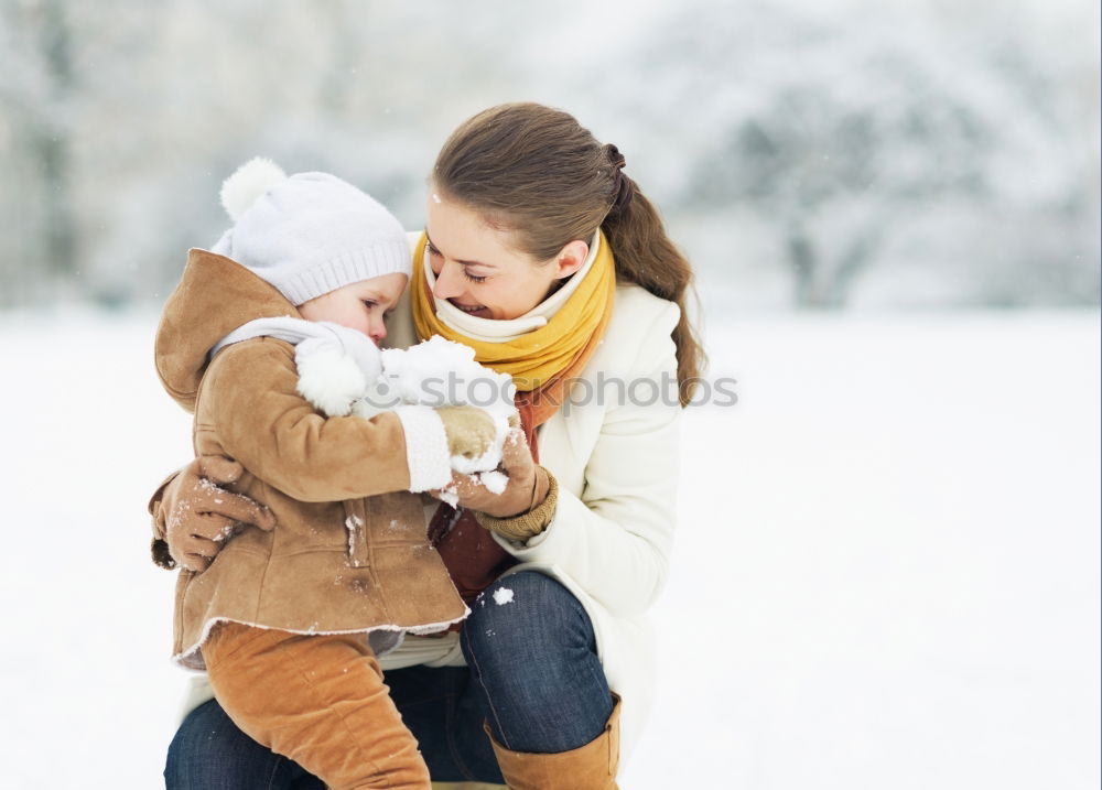 Similar – mother and baby on winter walk