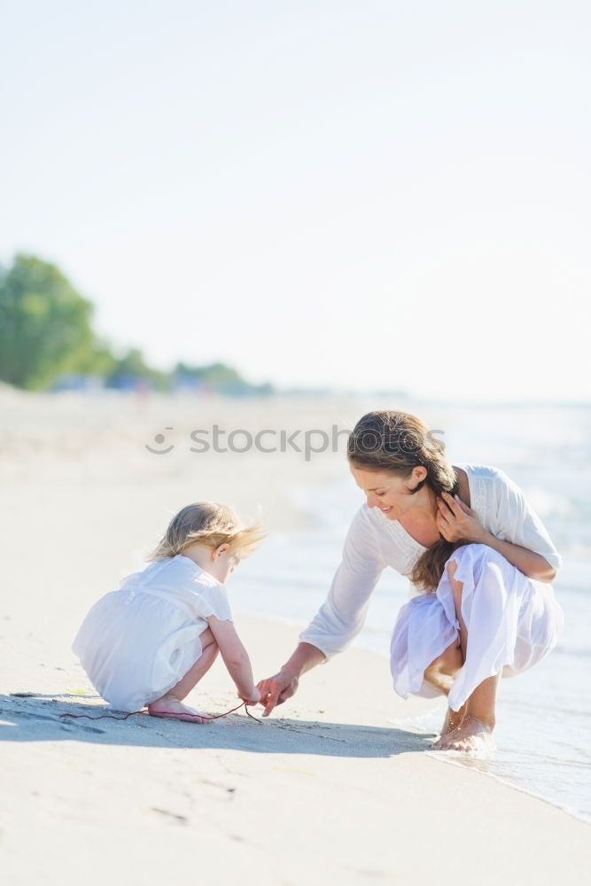 Similar – Two happy children playing on the beach