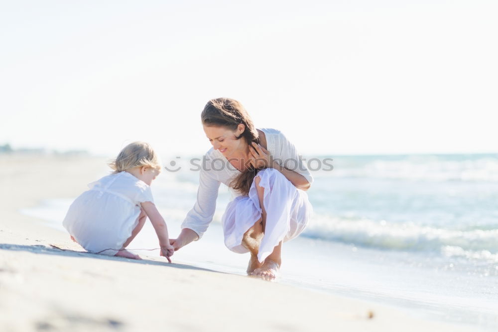 Similar – Sister and brother playing on the beach