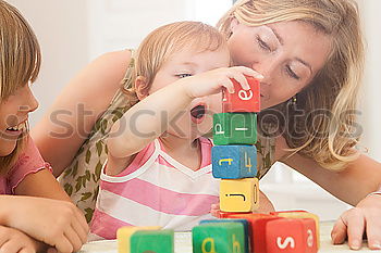 two beautiful sisters playing at home