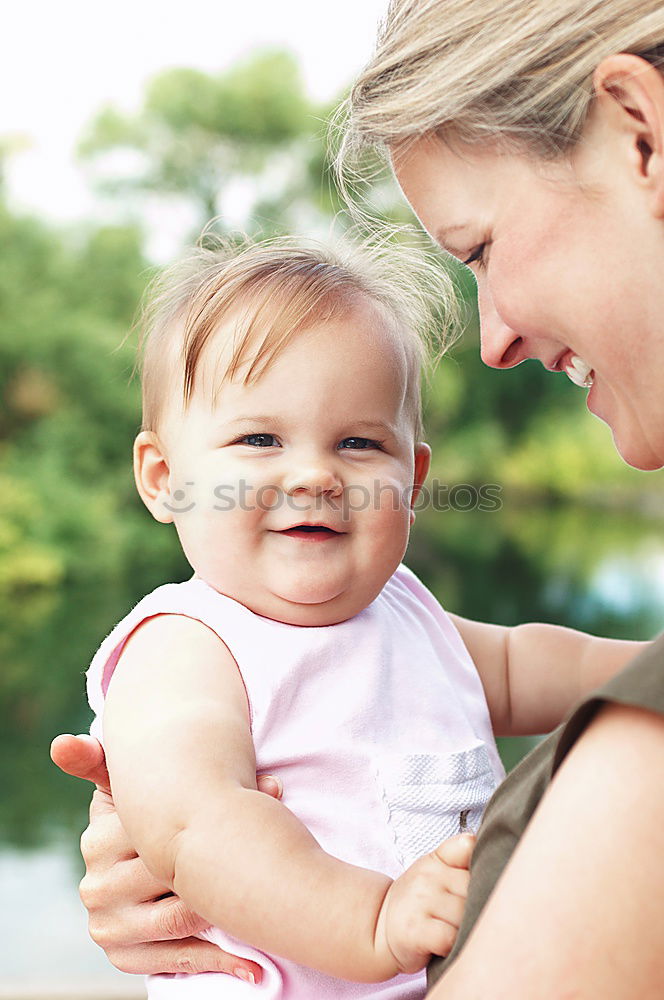 Similar – Image, Stock Photo Muslim mother holding a little baby by arms in outdoor area