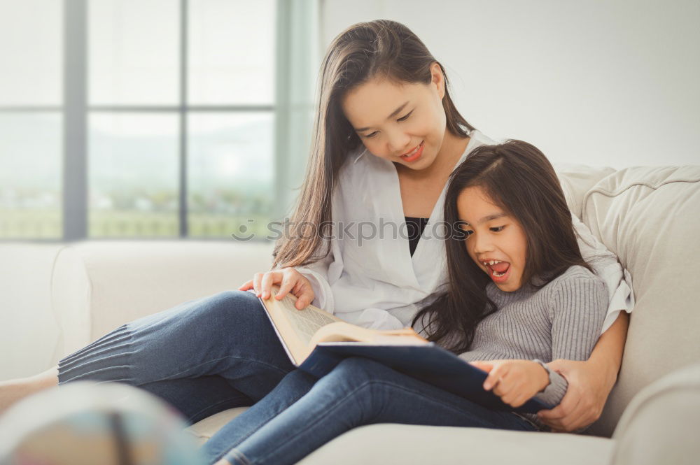 happy mother and toddler son using tablet