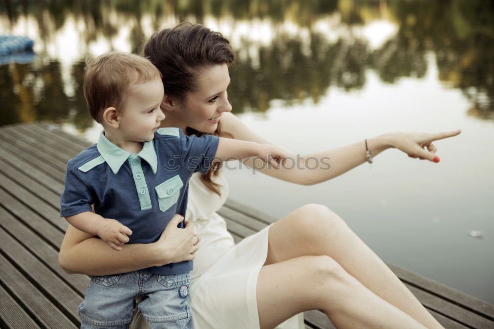 Similar – Sad mother and daughter sitting on bench in the park at the day time.