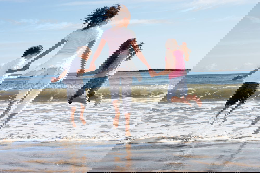 Similar – Image, Stock Photo Happy children playing on the beach at the day time.