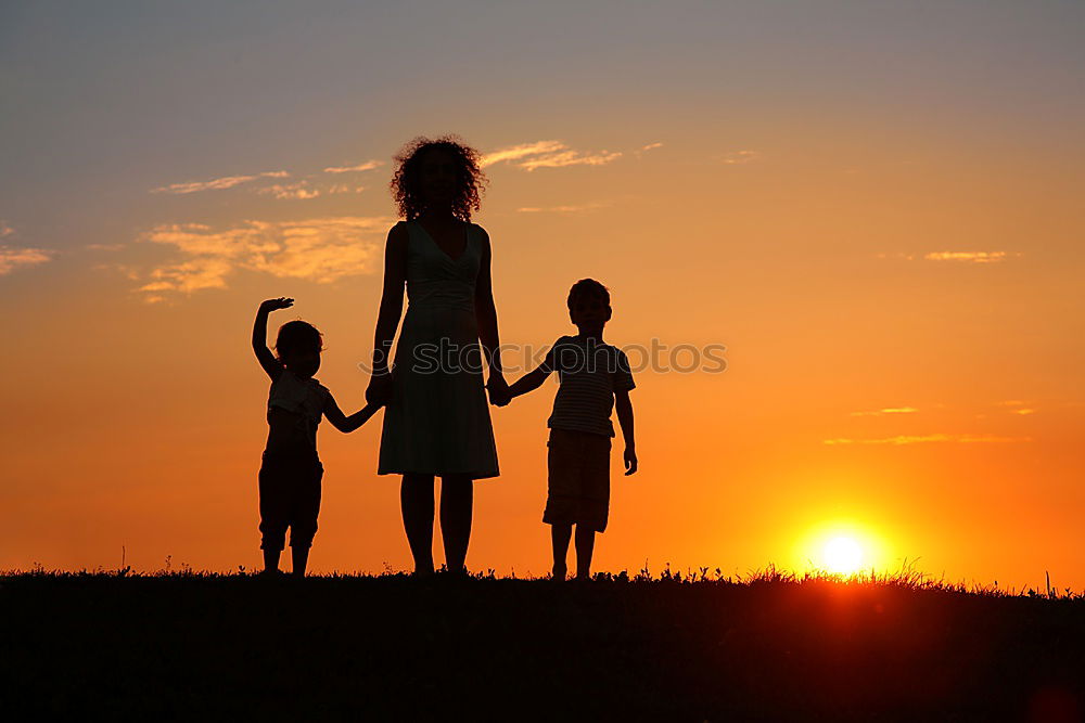 Image, Stock Photo Happy family standing in the park at the sunset time.