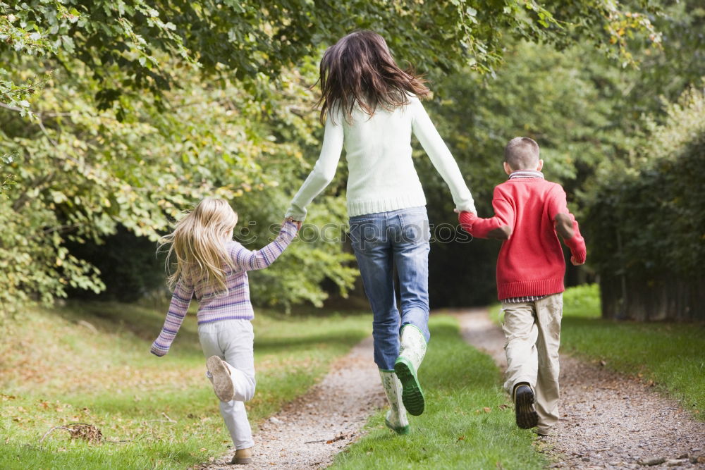 Similar – Image, Stock Photo Happy family walking together holding hands in the forest