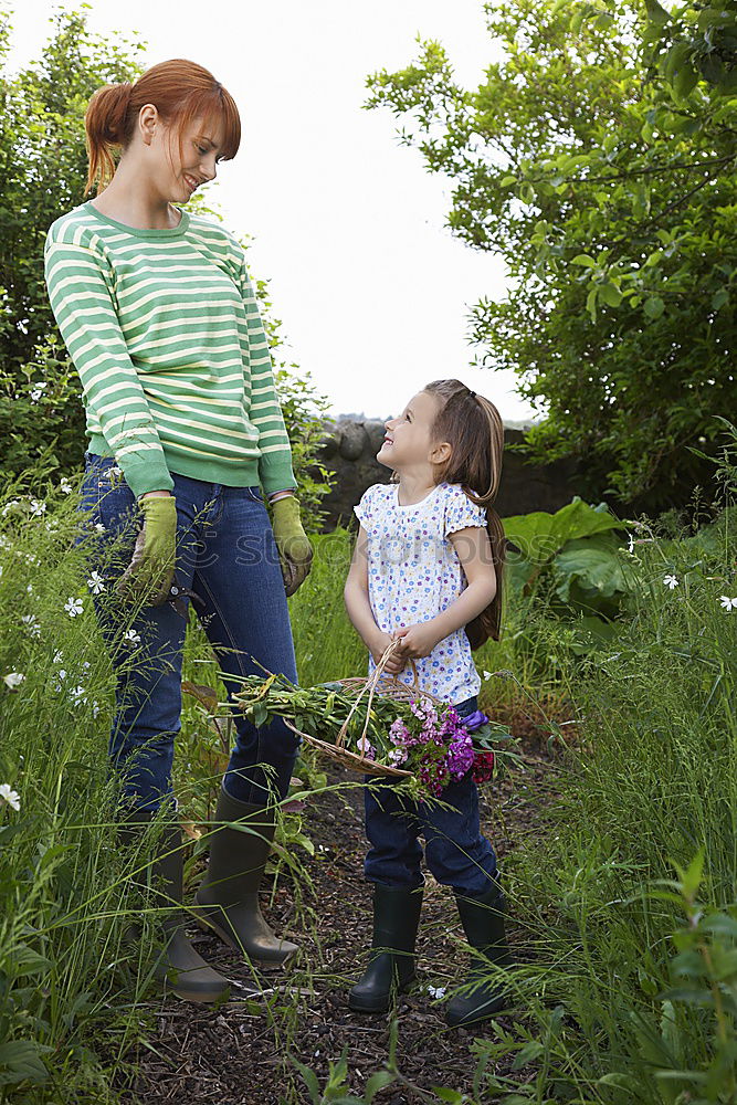 Similar – Granny sitting with her grandson on a meadow in nature