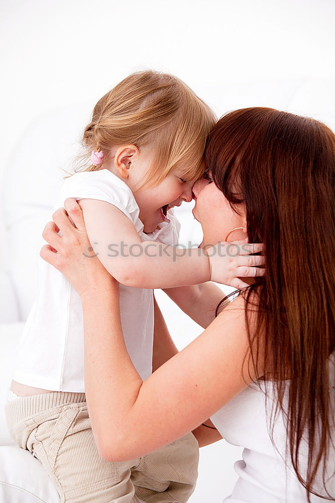 Similar – Image, Stock Photo Beautiful mother and daughter touching each other with their noses. Lovely family portrait