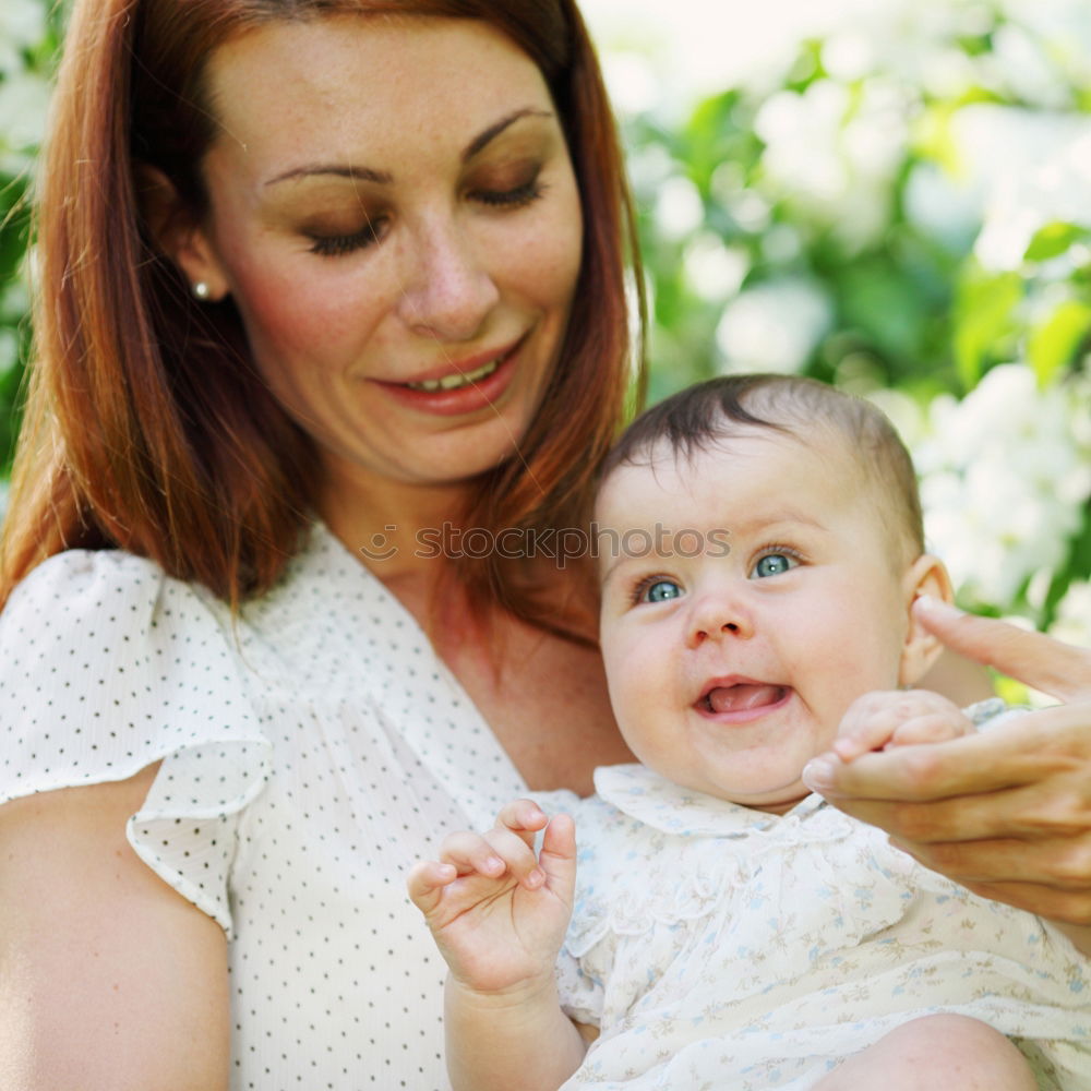 Similar – Image, Stock Photo Mother sitting with kid on hands