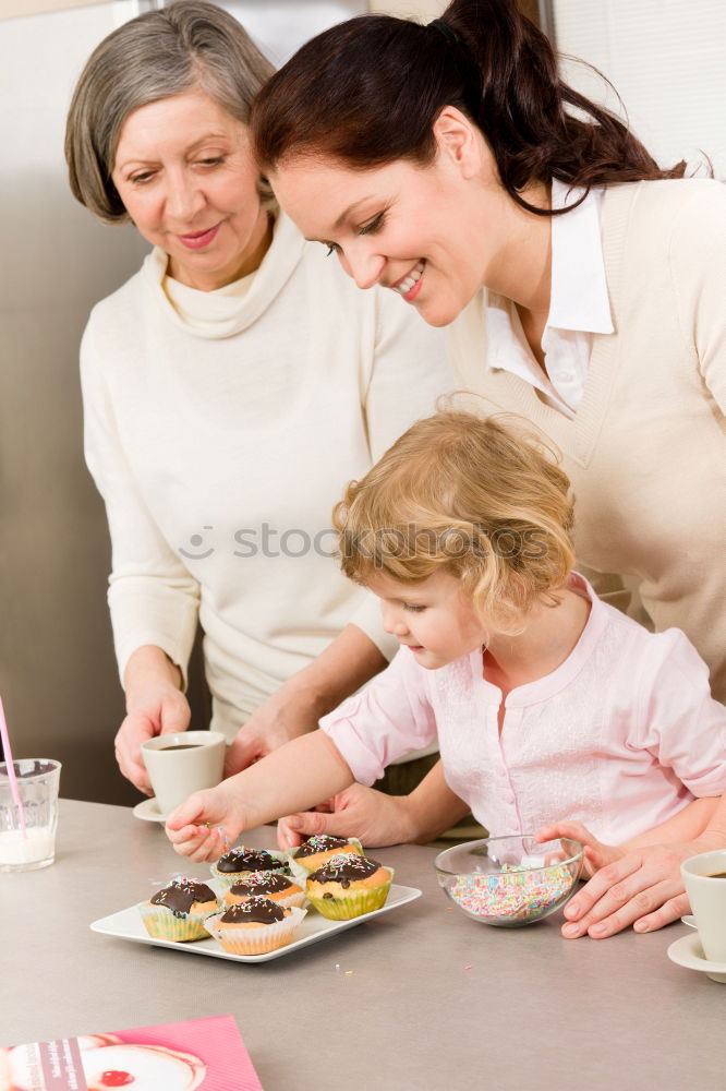 Similar – Little sisters girl preparing baking cookies.