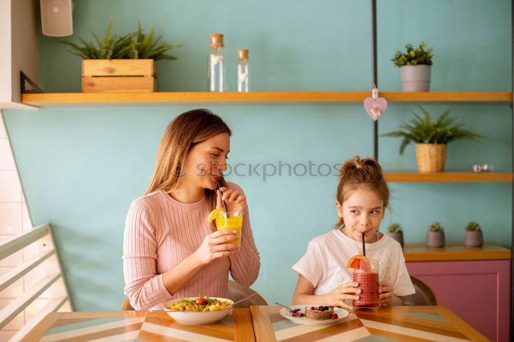 Similar – Image, Stock Photo Little sisters cooking with her mother in the kitchen.