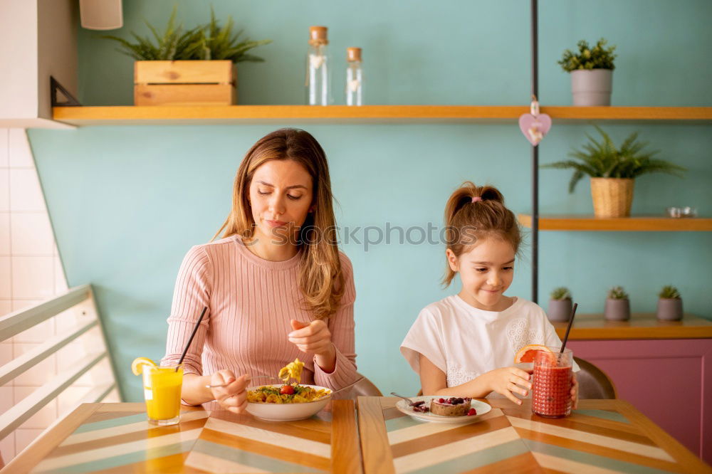 Similar – Image, Stock Photo Little sisters cooking with her mother in the kitchen.