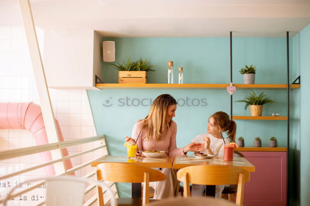 Two beautiful sister kids eating watermelon ice cream