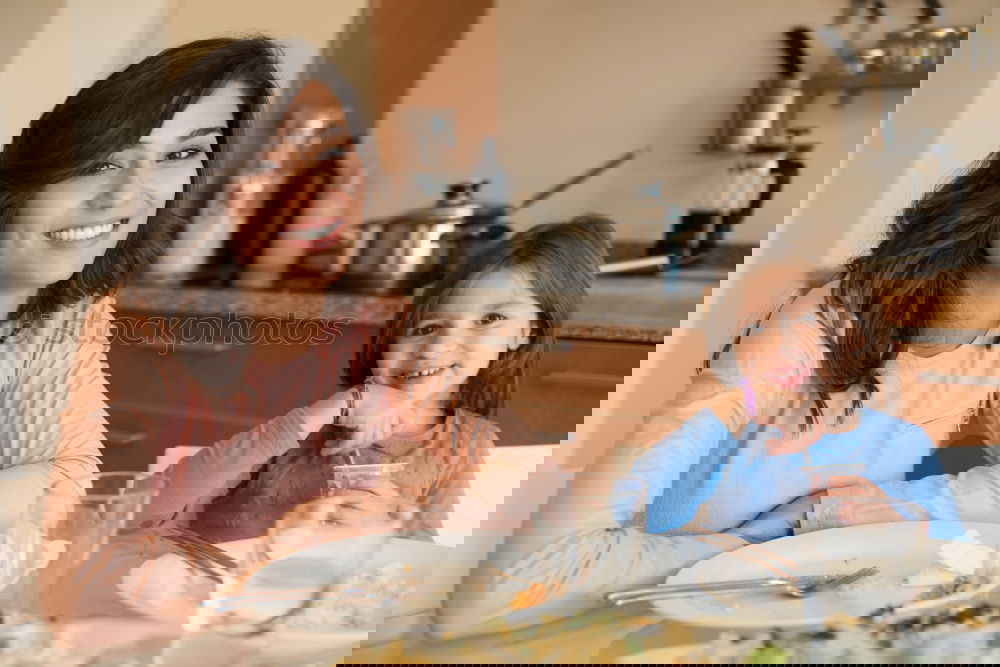 Similar – Image, Stock Photo Little girl cooking with her mother in the kitchen.