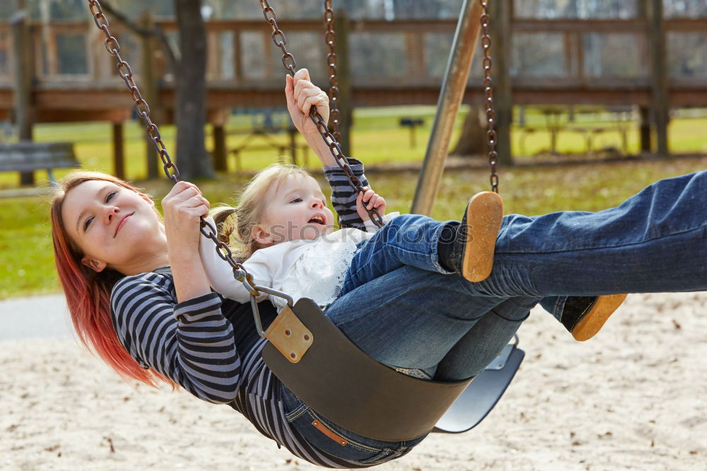 Similar – Cute caucasian siblings sitting on slide on playground