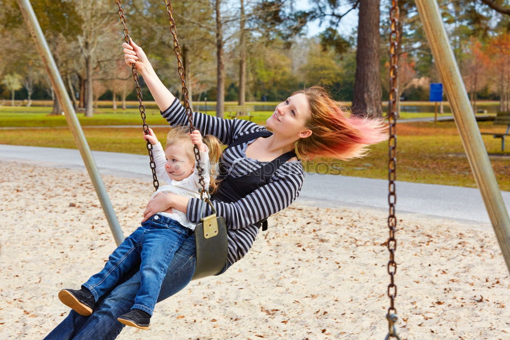 Similar – Cute caucasian siblings sitting on slide on playground