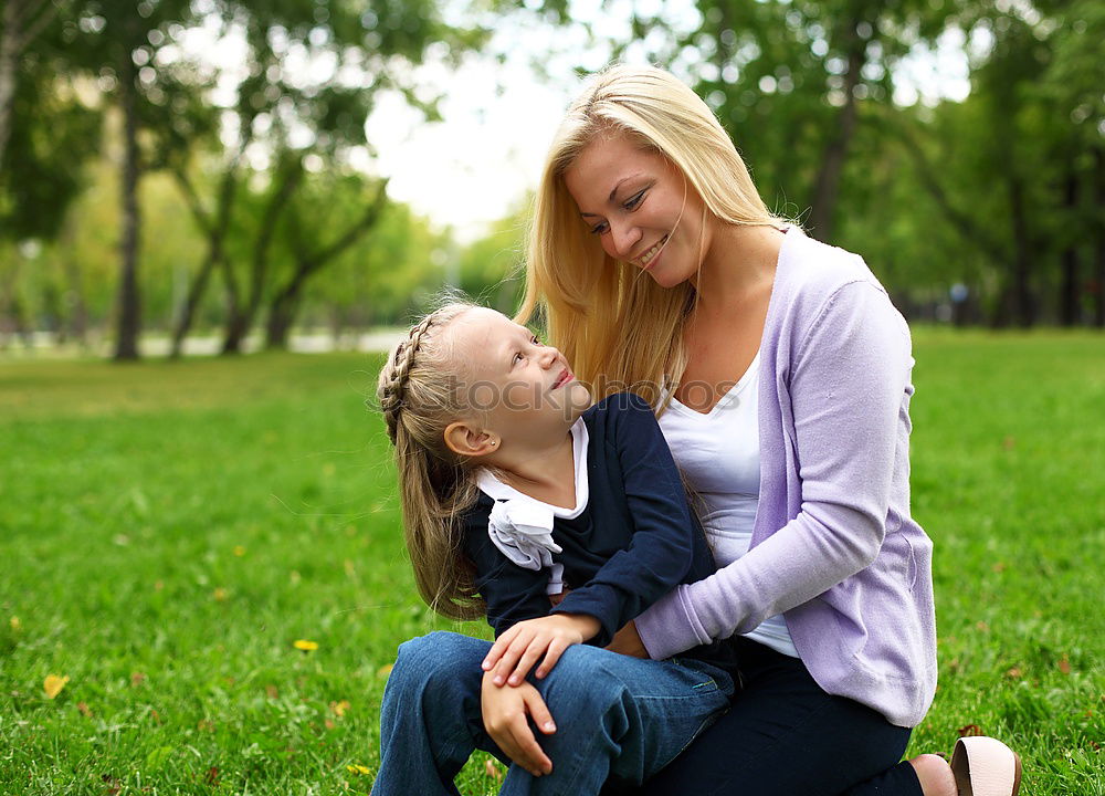 Similar – Kissing mother and daughter in summer