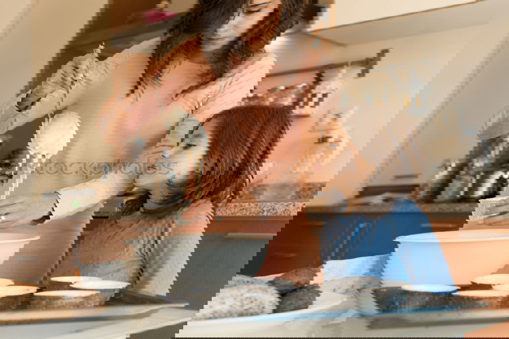 Similar – Image, Stock Photo Little sisters cooking with her mother in the kitchen.
