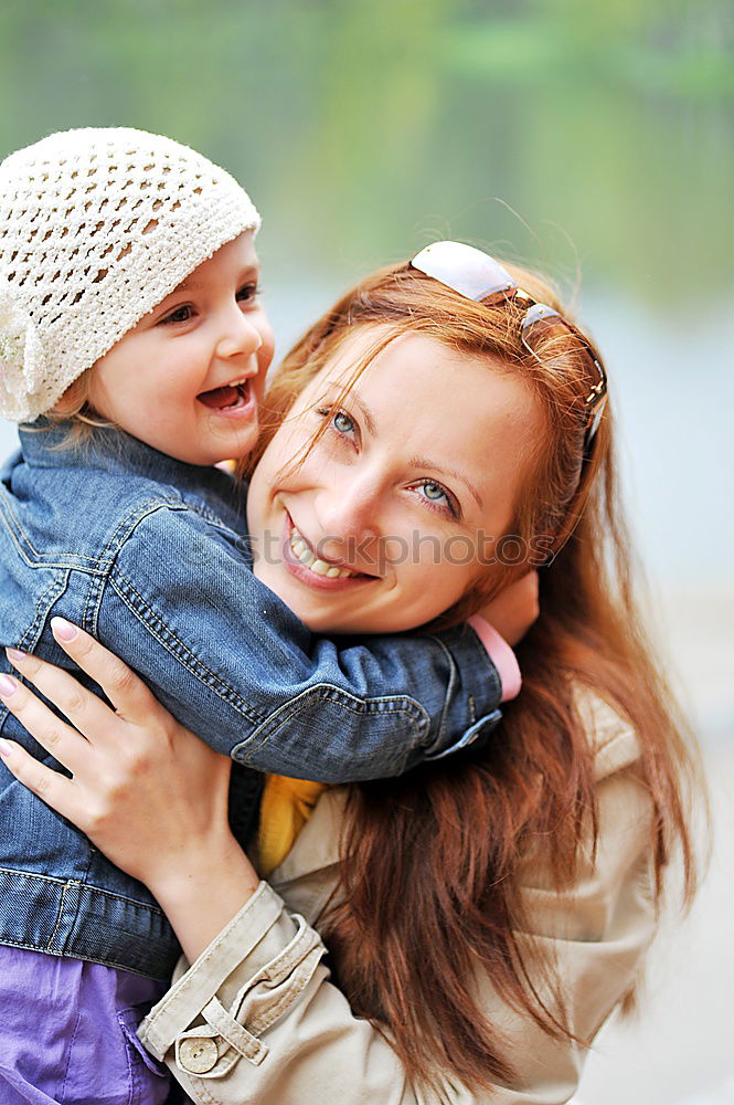 Similar – Image, Stock Photo Mother holding kid on hands in park