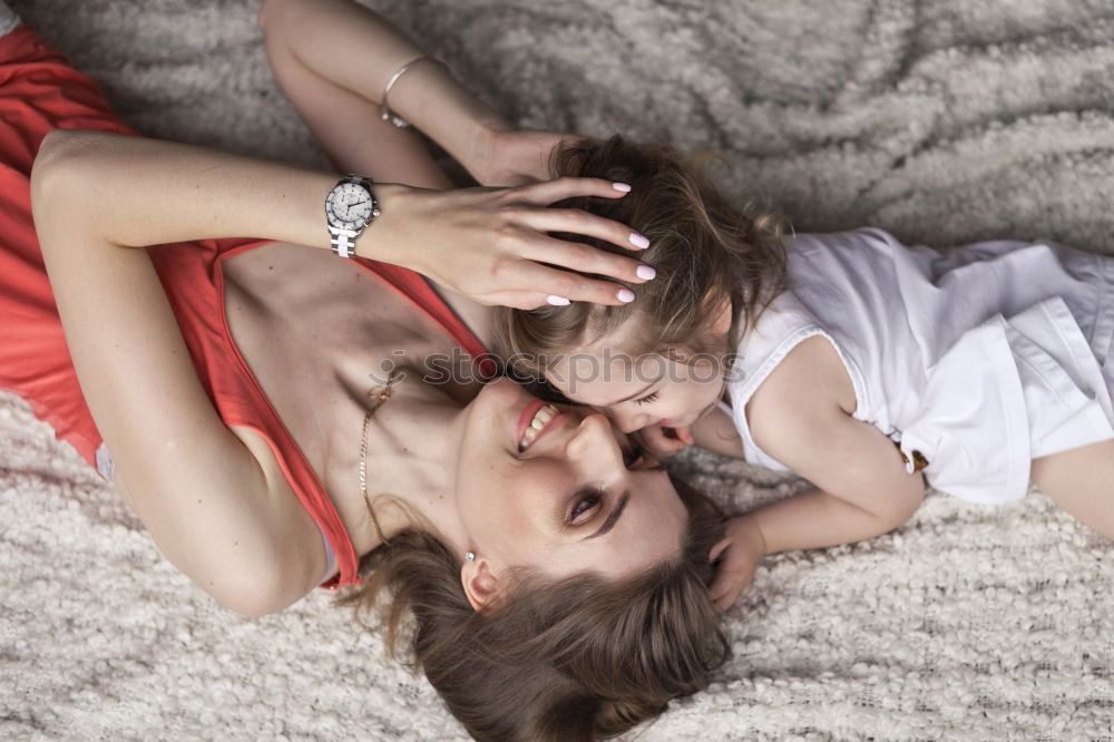 Similar – indoor portrait of happy mother comforting toddler son