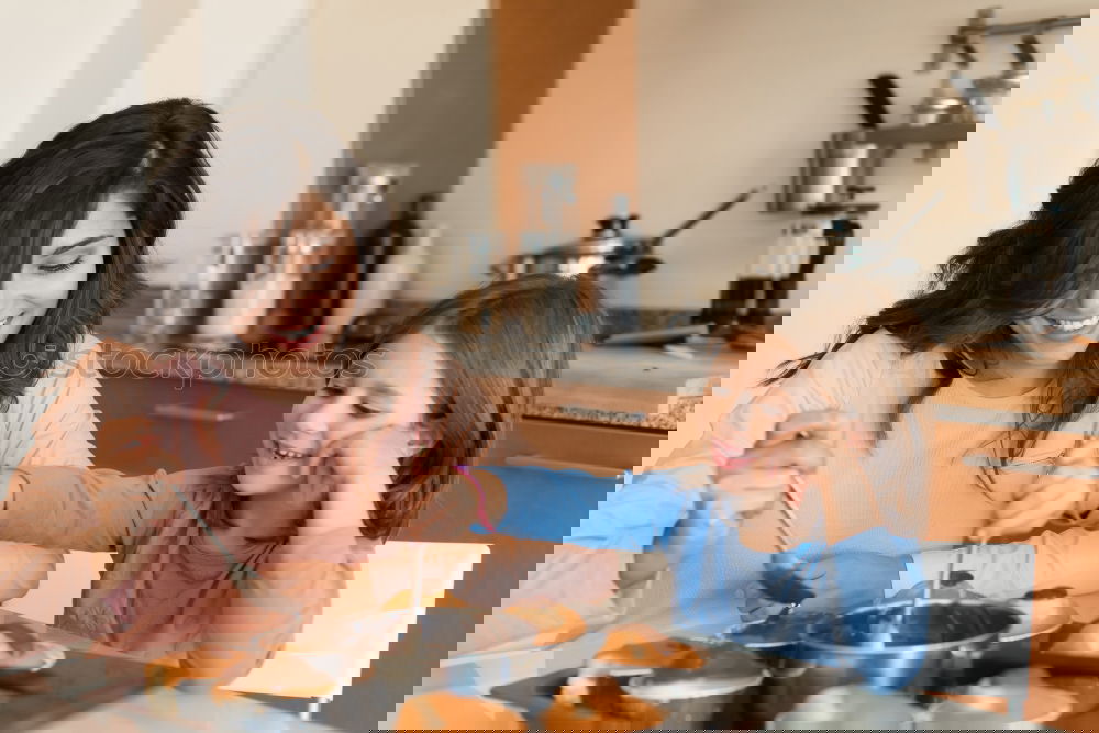 Similar – Image, Stock Photo Little sisters cooking with her mother in the kitchen.