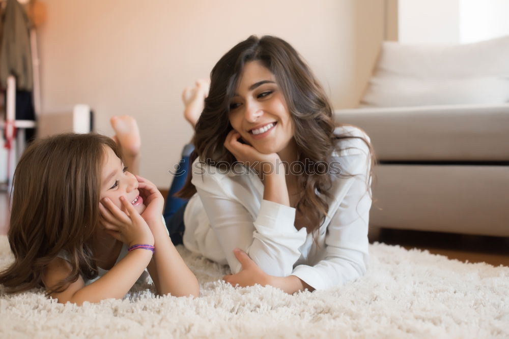 Similar – Image, Stock Photo African mother helping daughter doing homework