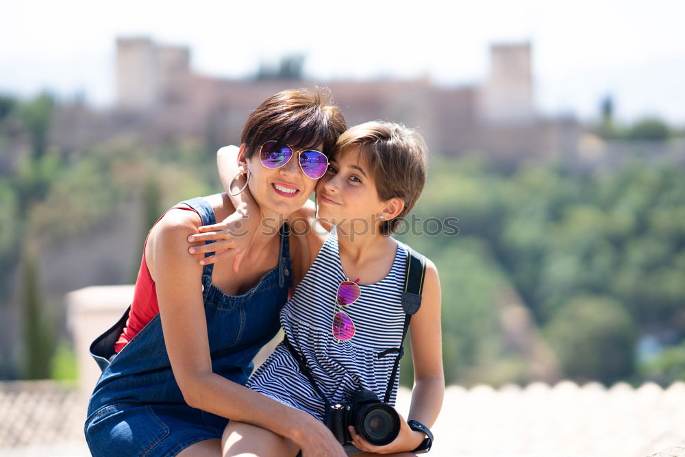 Similar – Two happy girls hugging in urban park.