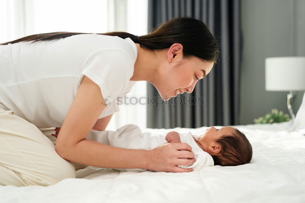 Similar – Baby girl playing with mother and have fun