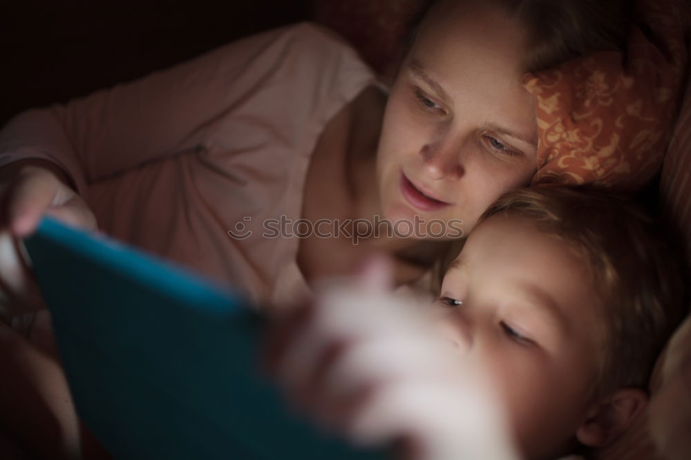 Mother and her child with digital tablet.