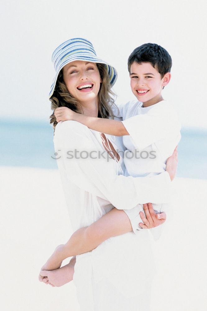 Similar – Father and children playing on the beach at the day time. Concept of friendly family.