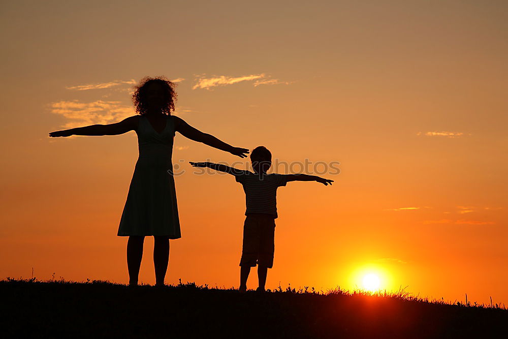 Similar – Image, Stock Photo Happy family standing in the park at the sunset time.