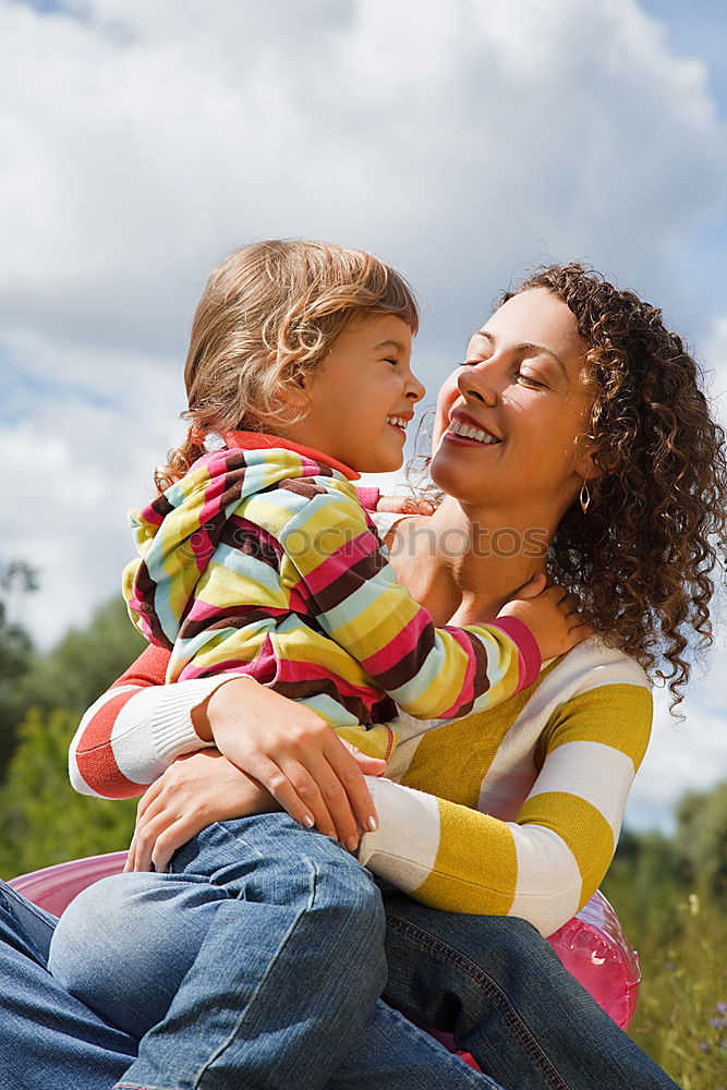 Similar – Image, Stock Photo Mother holding kid on hands in park