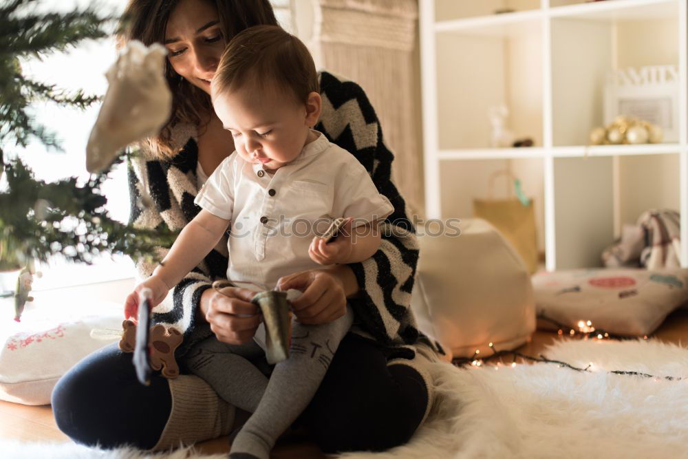 Similar – Image, Stock Photo Mother and son putting christmas costume on