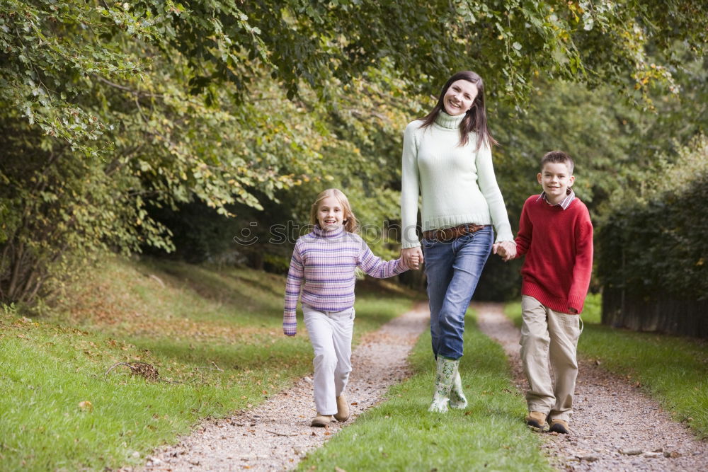 Similar – Image, Stock Photo Happy family walking together holding hands in the forest