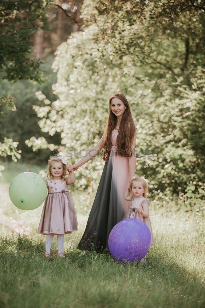 Similar – happy family: young mother walks with her child in the Park