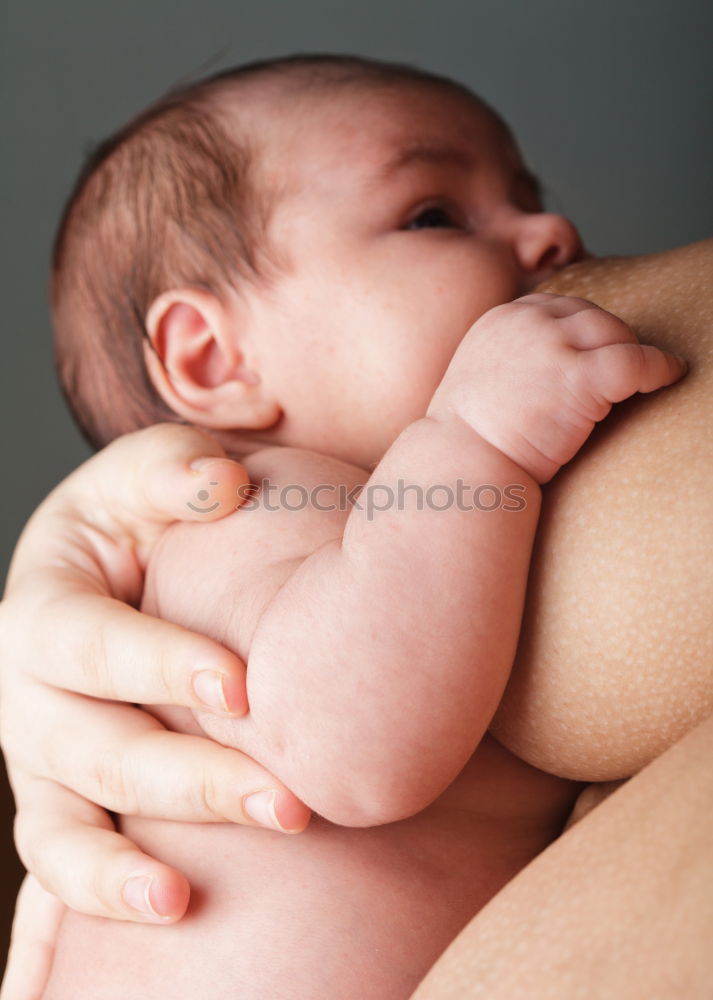 Similar – Father holding newborn baby son at the day time. Concept of happy family.