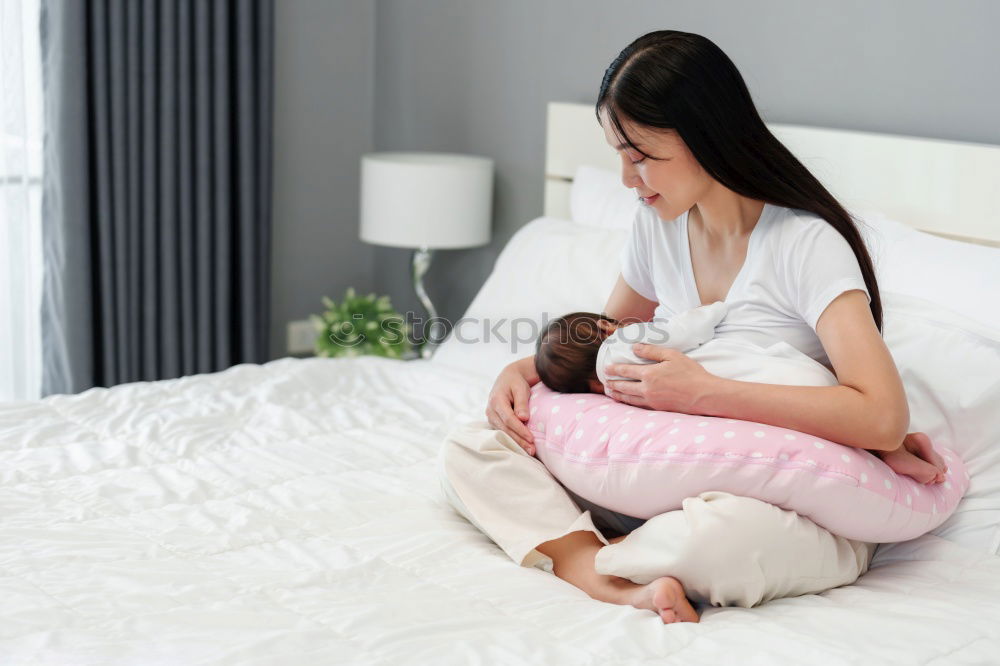 Similar – Mother breastfeed baby