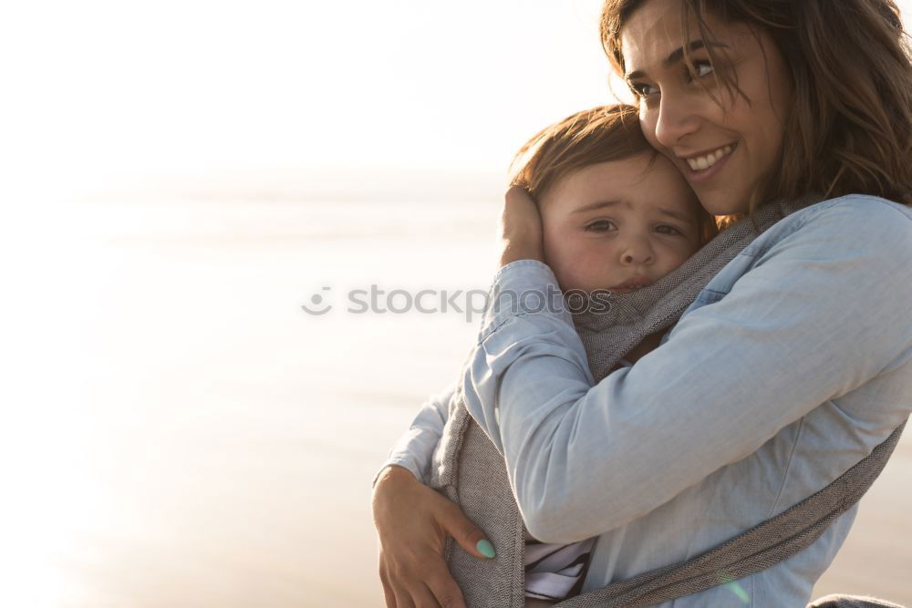 Similar – Image, Stock Photo caucasian mother having his son on her back at the beach