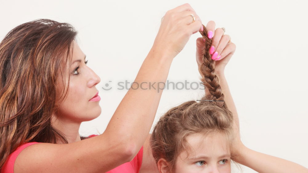 Similar – mother brushing toddler daughter’s hair