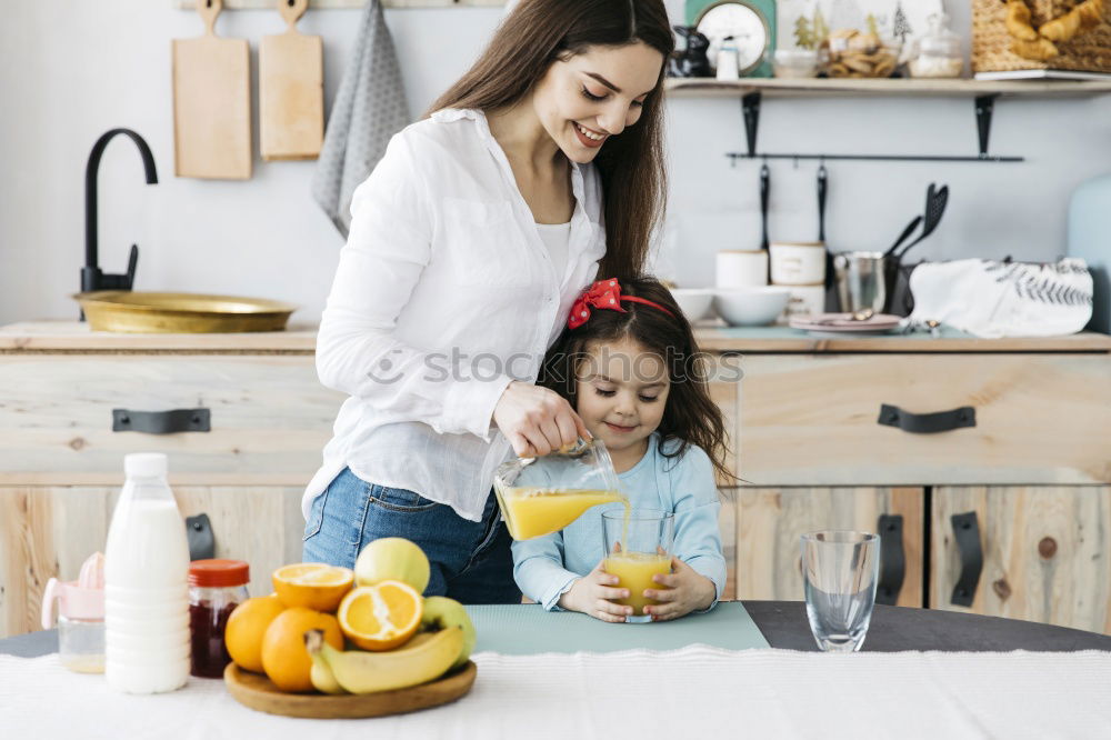 Similar – Image, Stock Photo little african girl is helping her mum preparing cupcake dough