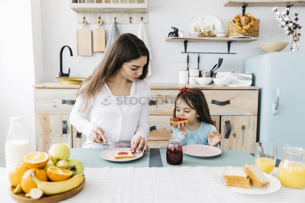 Similar – Mother and son baking together in kitchen