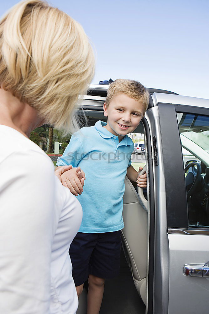 Similar – Happy father and son getting ready for road trip on a sunny day.