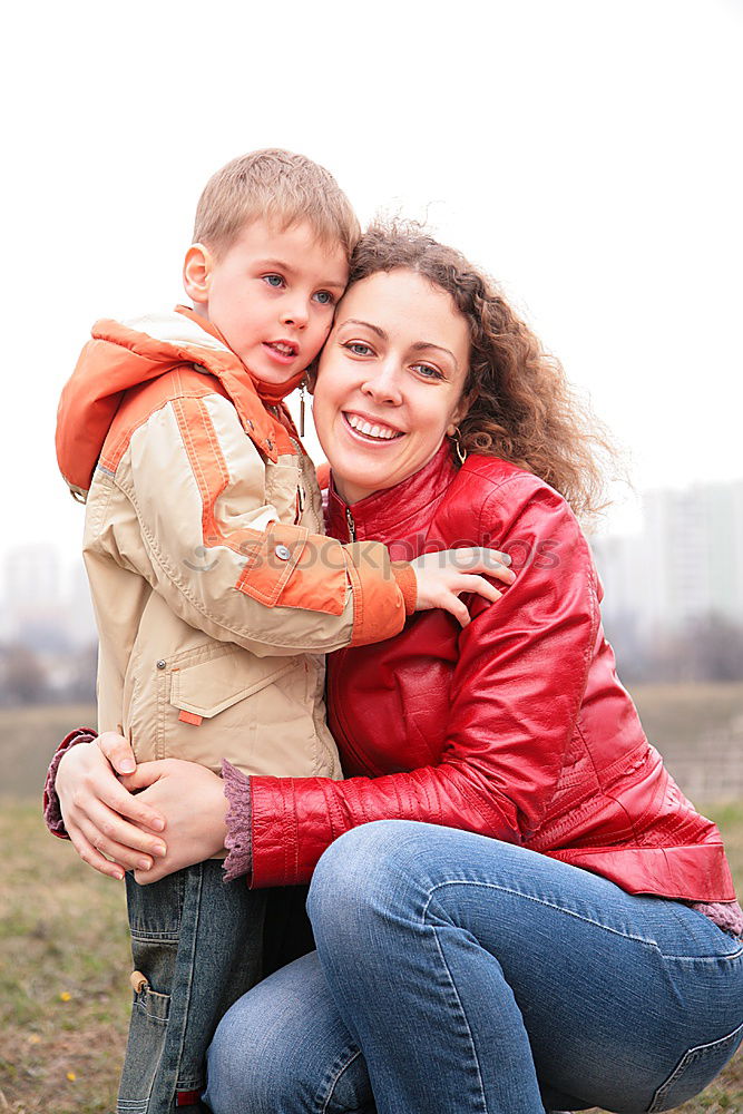 Similar – Image, Stock Photo A mother hugs her young son on the way to school, and a mother and boy say goodbye before school. Concept of education and training, return to school