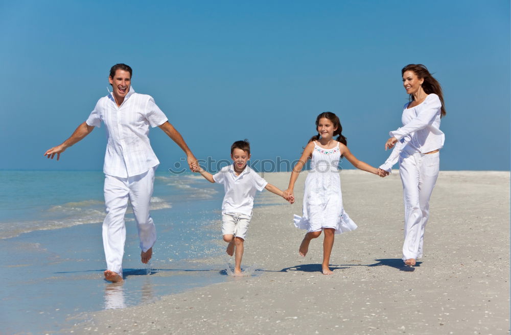 Similar – Image, Stock Photo Happy family walking on the beach at the day time. Concept of friendly family.